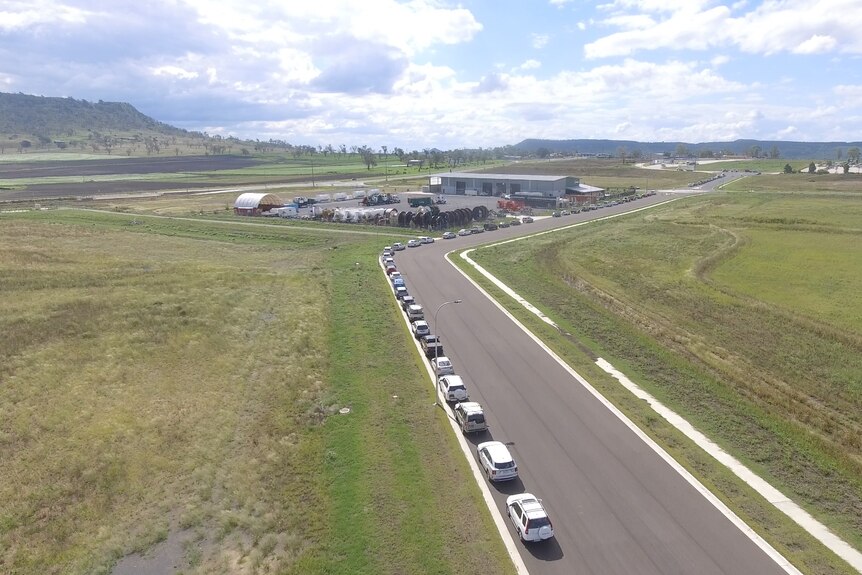 Aerial shot of a long line of cars at a covid testing facility near Toowoomba