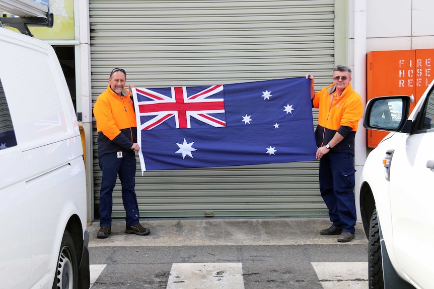 Michael Ariolie and Marc Hirzel are based in the ACT's flag store in Fyshwick.