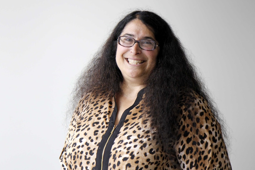 Woman with long curly, dark hair