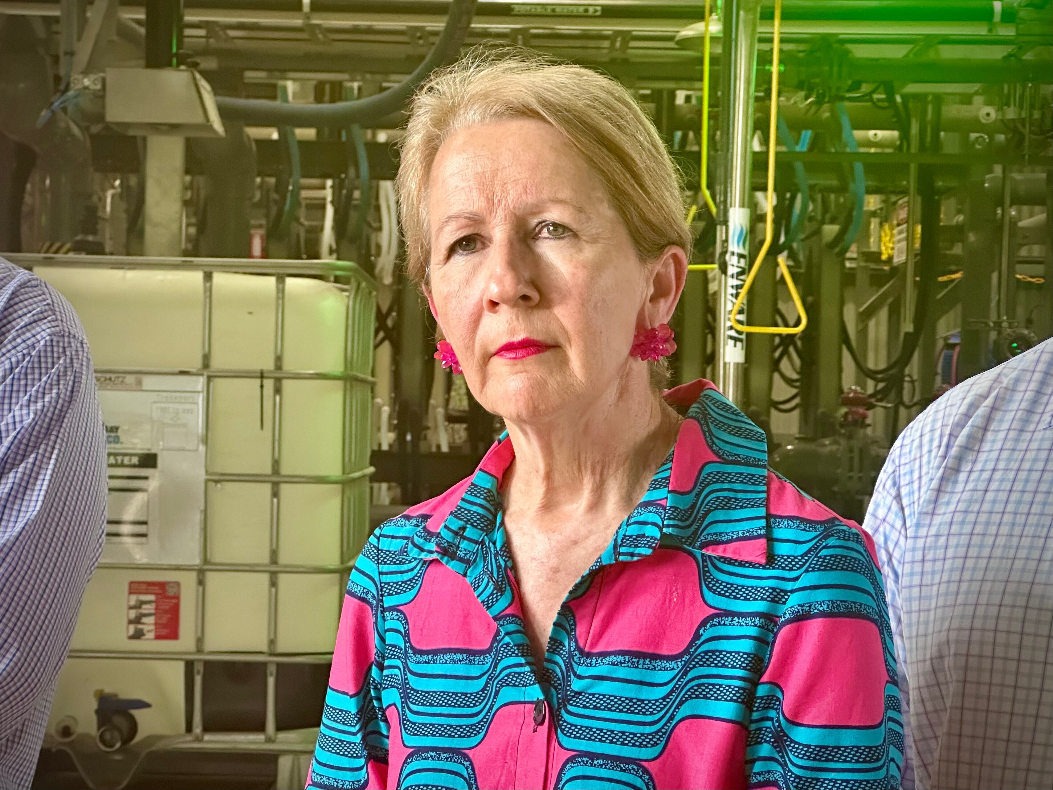 Woman stand in front of camera.