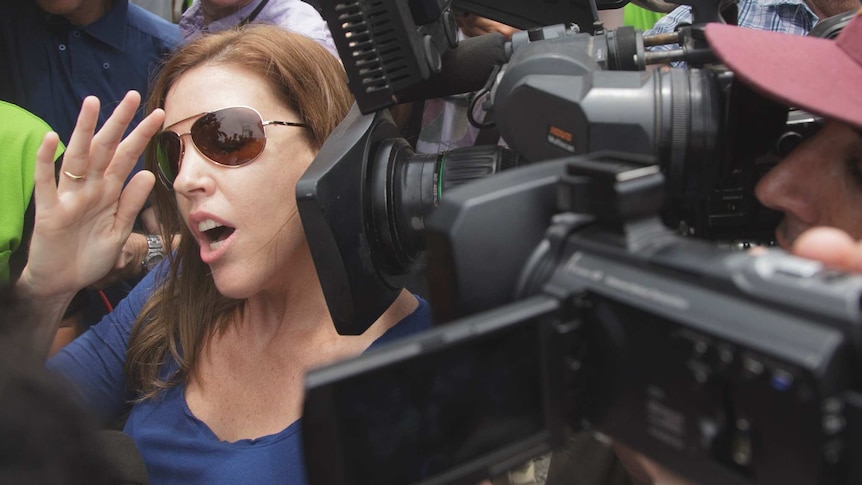 Mercedes Corby gives a statement to the media outside Kerobokan prison in Bali.