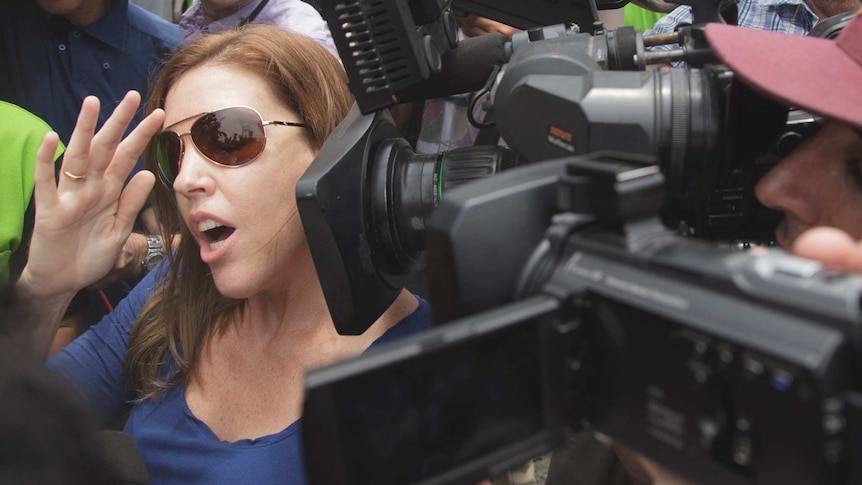 Mercedes Corby surrounded by media pack outside prison in Bali.