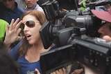 Mercedes Corby gives a statement to the media outside Kerobokan prison in Bali.
