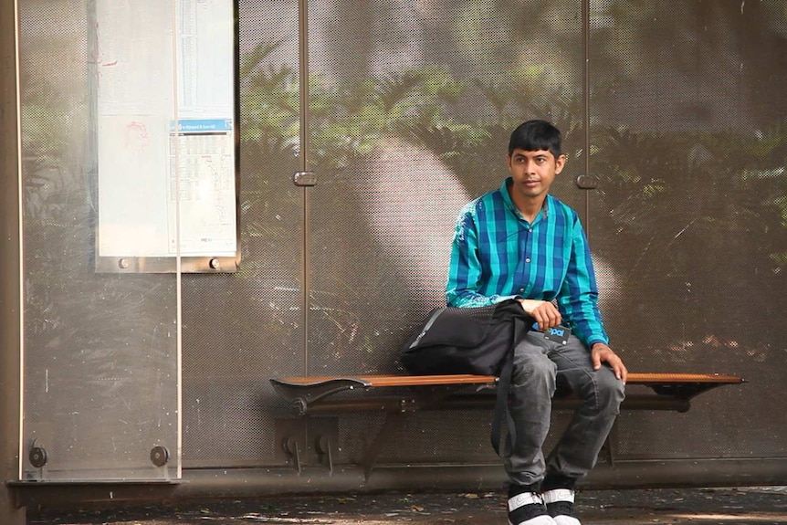 Shahid Mahmood waits at a sydney bus stop