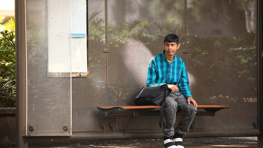 Shahid Mahmood waits at a sydney bus stop