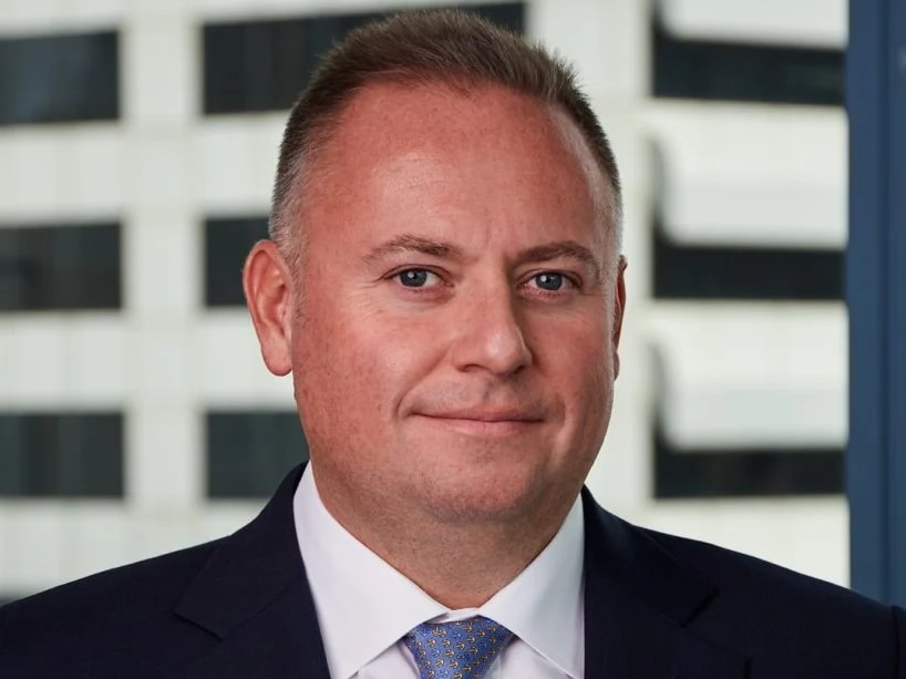 Close up headshot of a man in a suit