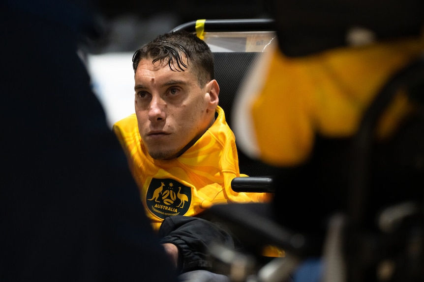 a close up shot of an australian palyer at the powerchair football world cup in sydney