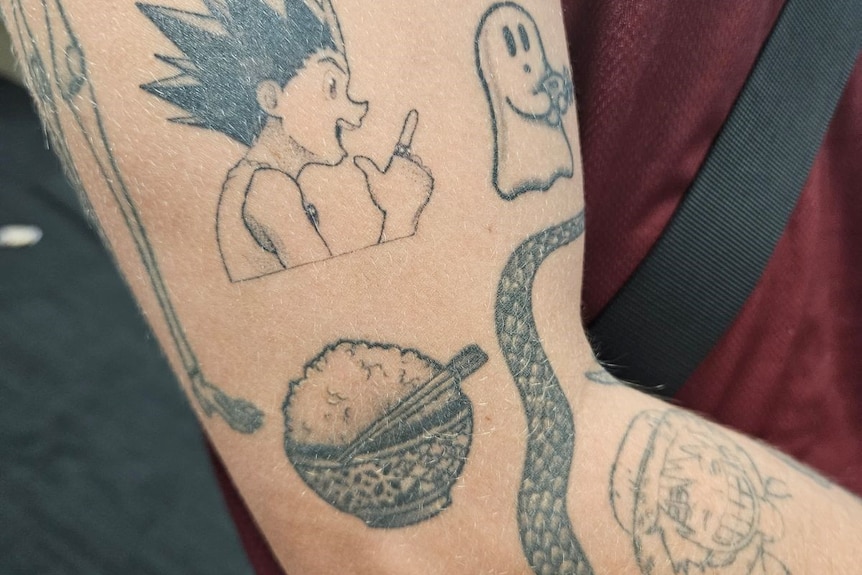 Cassiel Rousseau's tattoos on his arm