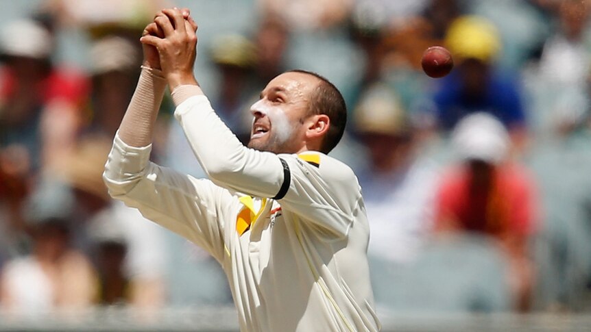 Australia's Nathan Lyon drops a return catch during the third Test against India at the MCG.