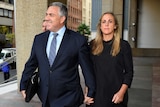 Joe Hockey arrives at court with his wife Melissa Babbage