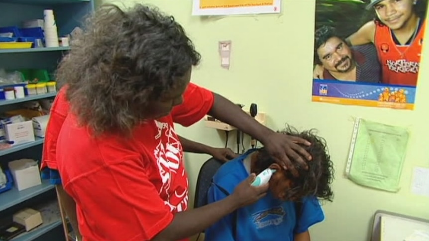 A man has his ears checked with an instrument