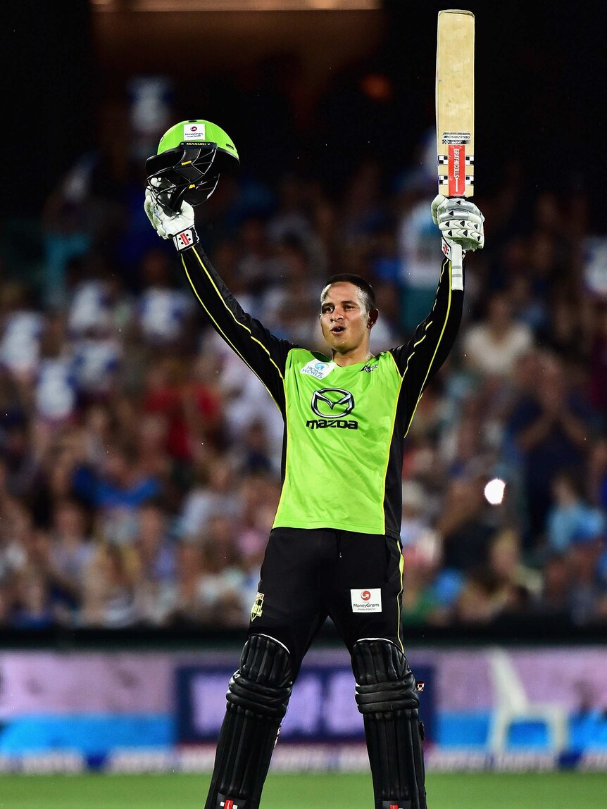 Awesome display ... Usman Khawaja acknowledges the crowd after reaching his century