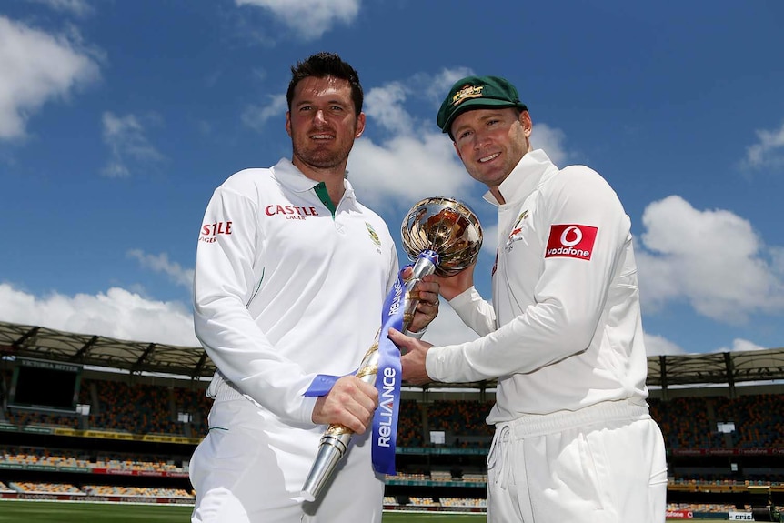 Graeme Smith (left) and Australia captain Michael Clarke pose with the ICC Test Championship mace