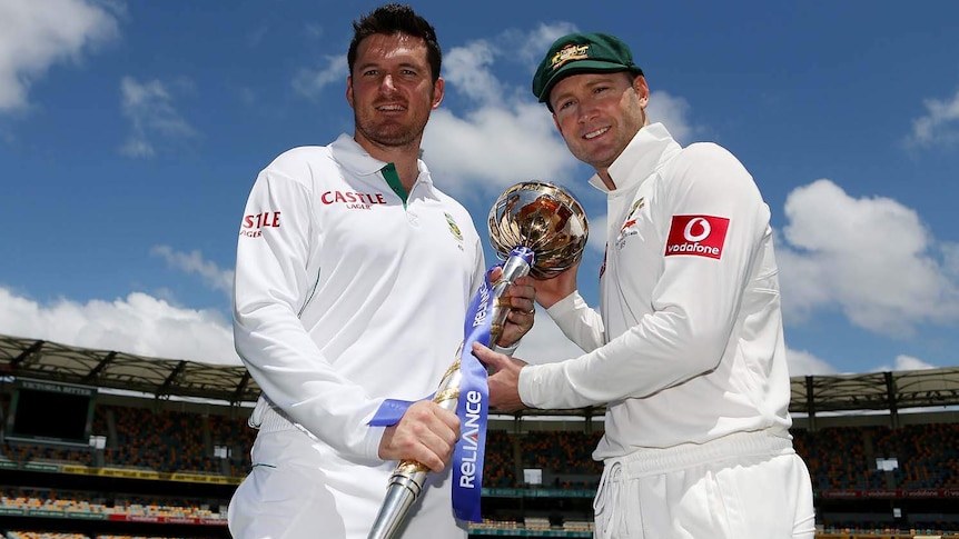 Graeme Smith (left) and Australia captain Michael Clarke pose with the ICC Test Championship mace
