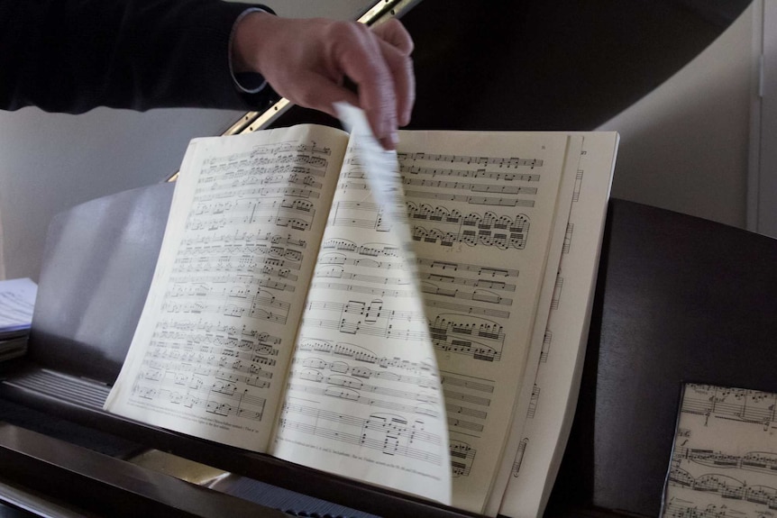 Pages of music being turned