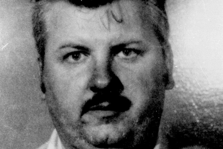 A black and white photo of John Wanye Gacy