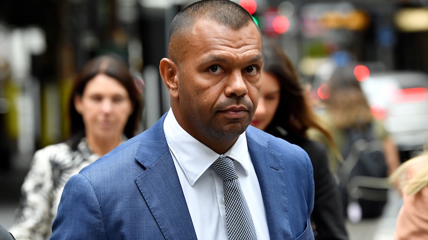Kurtley Beale outside court wearing a suit and tie