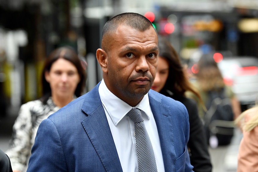 Kurtley Beale outside court wearing a suit and tie