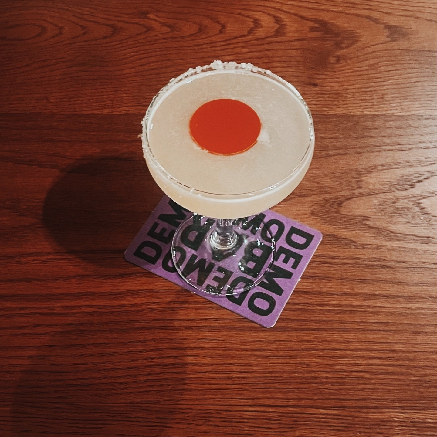 a cocktail drink sits on a table at Bar Demo in Sydney's enmore