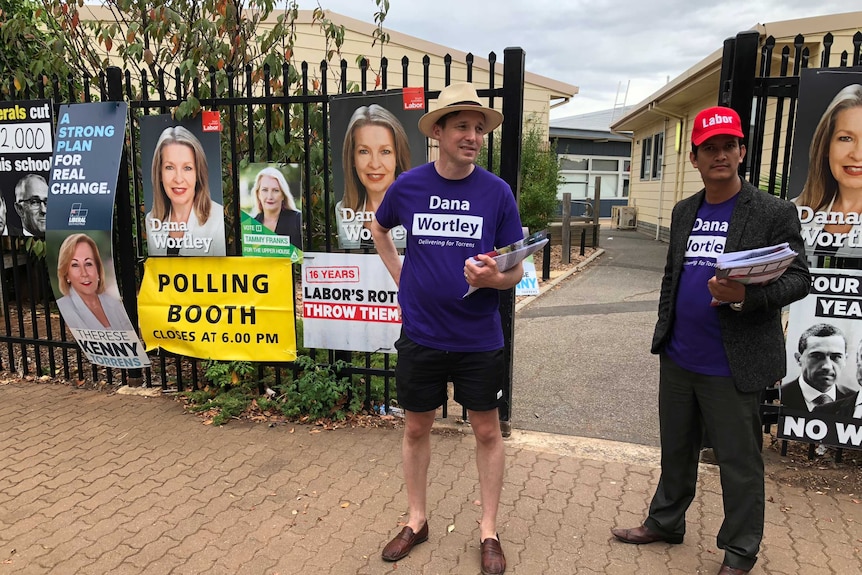 Election volunteers for Labor MP Dana Wortley wearing purple shirts.