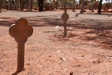 A figure stuck in red dirt at the Kalgoorlie Cemetery that reads '3890'
