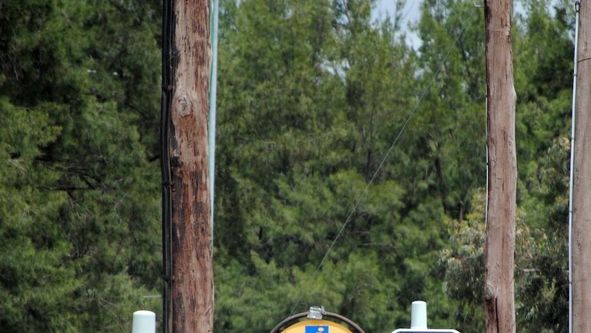 Floodwaters engulf traffic lights on the corner of Macquarie St and the Mitchell Hwy in Dubbo