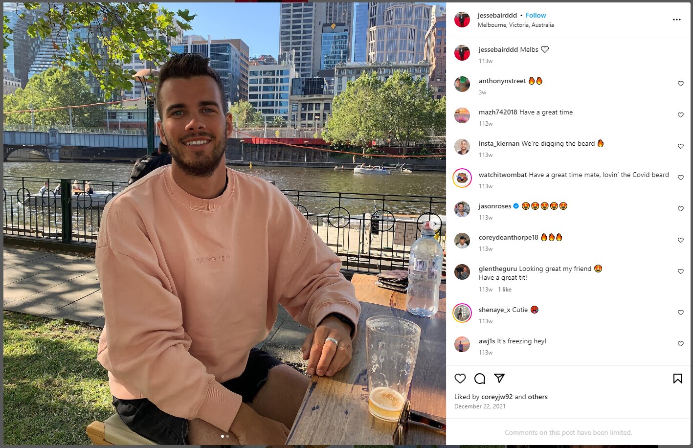 A man sat at a table outdoors