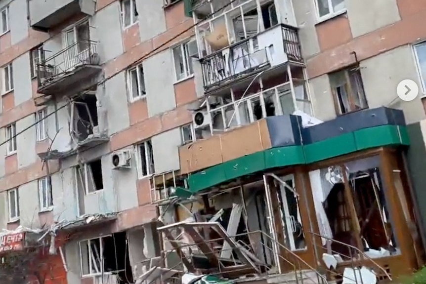 Exterior of shelled apartment building.