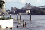 The submerged riverside walkway at Pier 9 in the Brisbane CBD goes under in the floods on January 12, 2011.