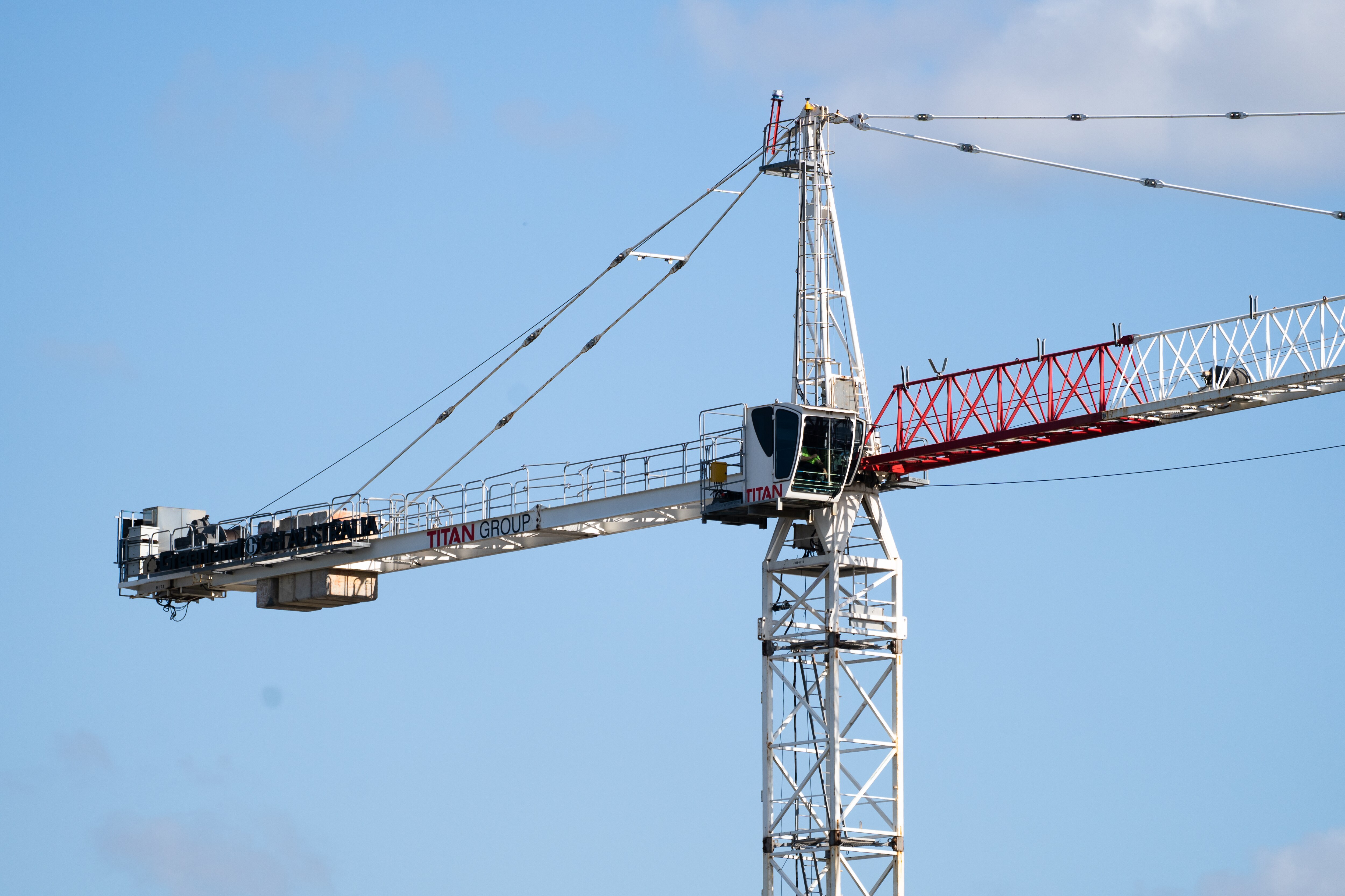 Building covered in scaffolding, construction, crane