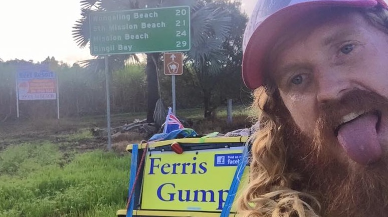 Ferris Gump poses for a photograph near a road sign in far north Queensland.