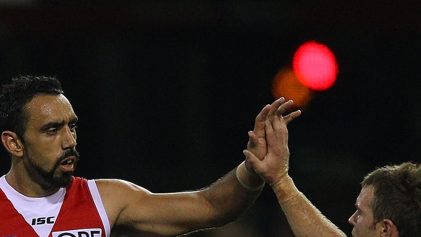 Adam Goodes and Ben McGlynn put the hurt on the Lions.