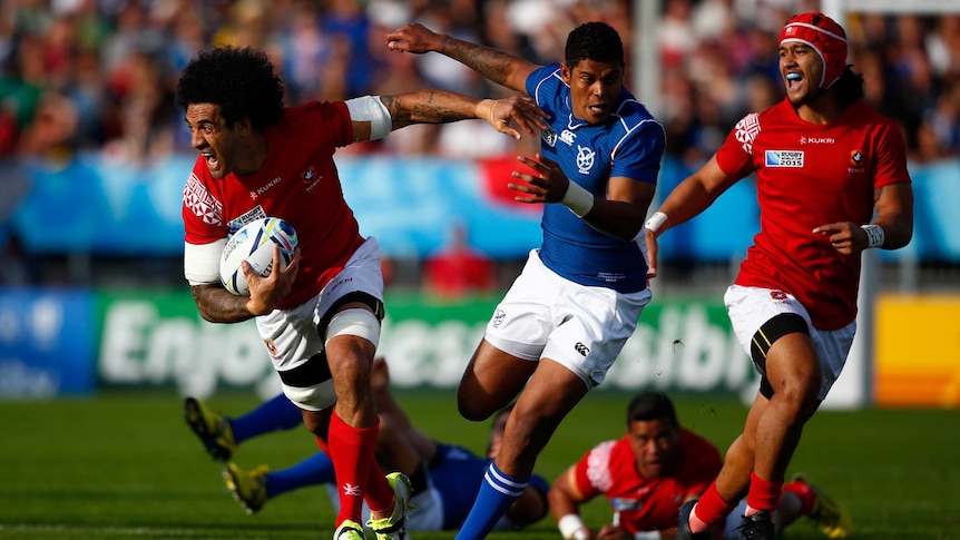 Tonga's Hale T-Pole runs at the Namibian defence in their Rugby World Cup Pool C match in Exeter.