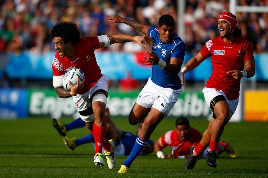Tonga's Hale T-Pole runs at the Namibian defence in their Rugby World Cup Pool C match in Exeter.