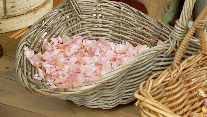 Pink petals in wicker basket
