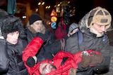 Supporters carry presidential candidate Vladimir Neklyayev to his campaign headquarters