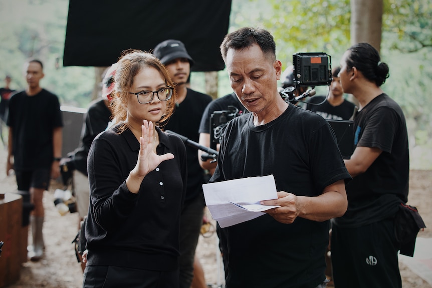 Ginanti Rona directing a scene with a crew member.