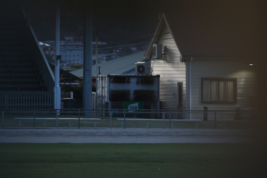 A closed betting window near a race track.