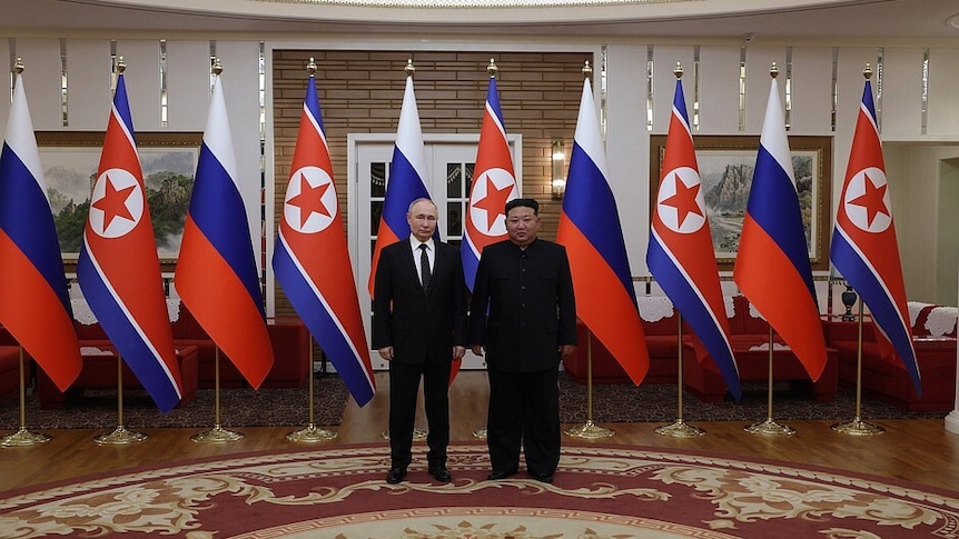 Russian President Vladimir Putin and North Korean Supreme Leader Kim Jong Un pose for a photo