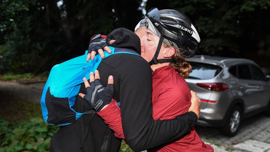 Fiona Kolbinger hugs a cyclist after winning the Transcontinental Race