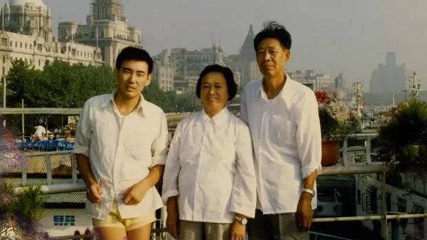 Yang Hengjun pictured with his parents during his university years.
