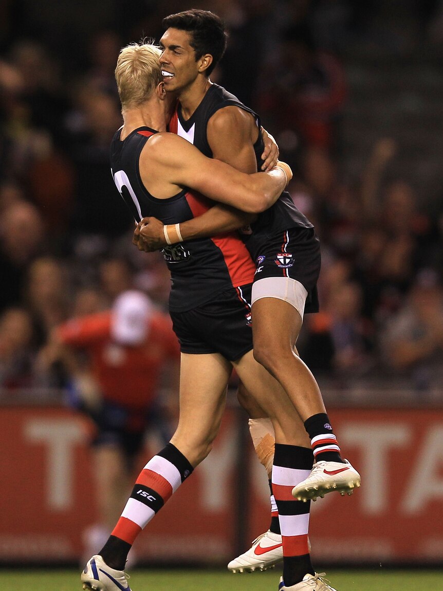 Moment in the sun ... St Kilda's Terry Milera celebrates scoring the opening goal with captain Nick Riewoldt.