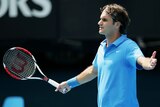 Roger Federer disagrees with a line call