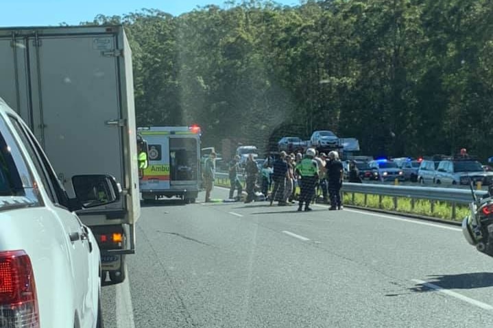 Photo taken from Ms Barnes' car showing the arrest Dylan Matthew Hammond on the Bruce Highway.