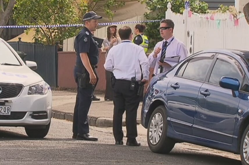 Police at the scene where a man's body is found at a house in Bendigo Street