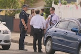 Police at the scene where a man's body is found at a house in Bendigo Street