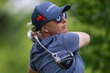 An Australian female golfer hits a tee shot at an LPGA Tour event in New Jersey.