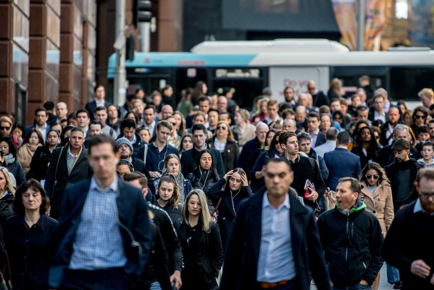 Hundreds of workers in the city walking