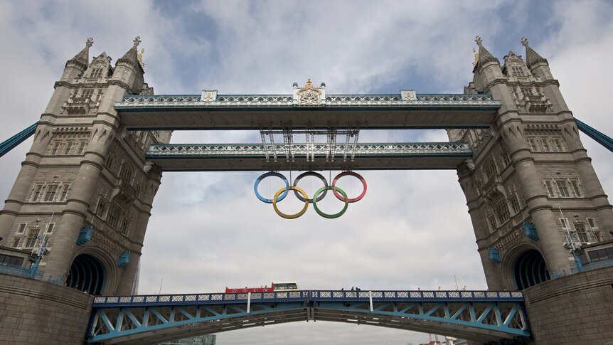 A month to go ... The 2012 Olympic rings are unveiled on London's Tower Bridge