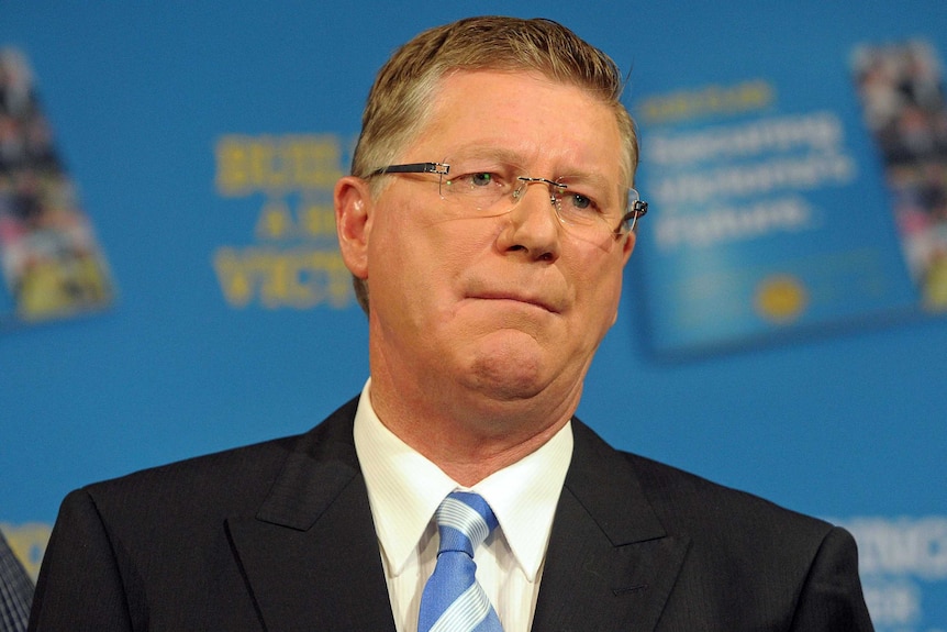 A file photo of man in a suit at a press conference